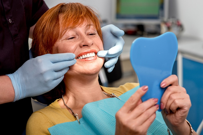 Replacing Missing Teeth: Dentures vs. Dental Implants